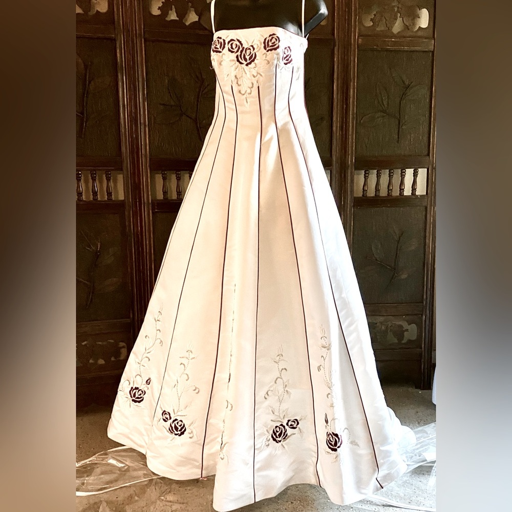 Jessica Designs International satin sleevelessbridal gown with embroidered roses